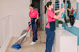 Two GURUs dusting a home.
