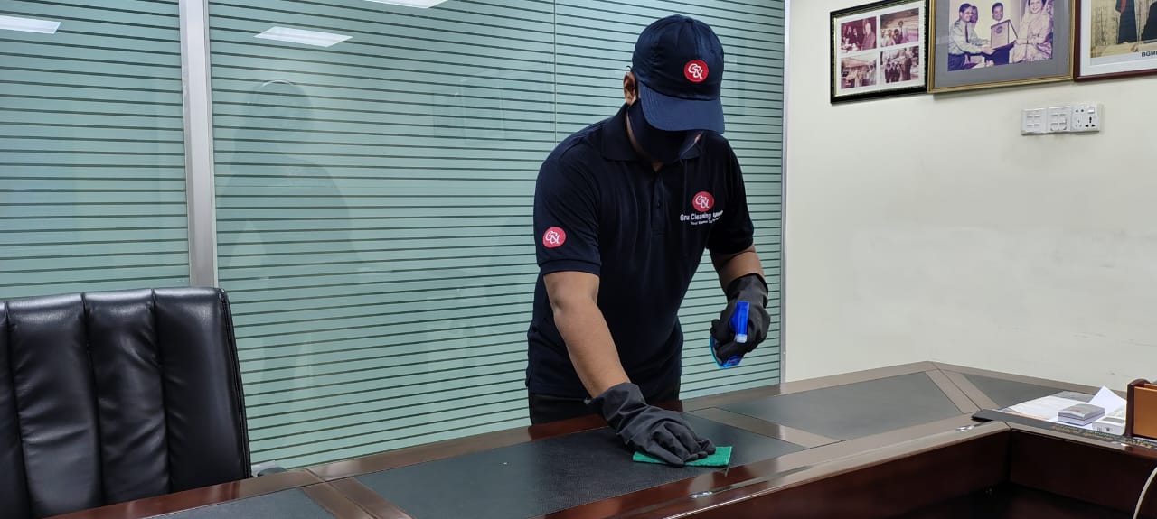 GURU® employee cleaning a customer’s home.